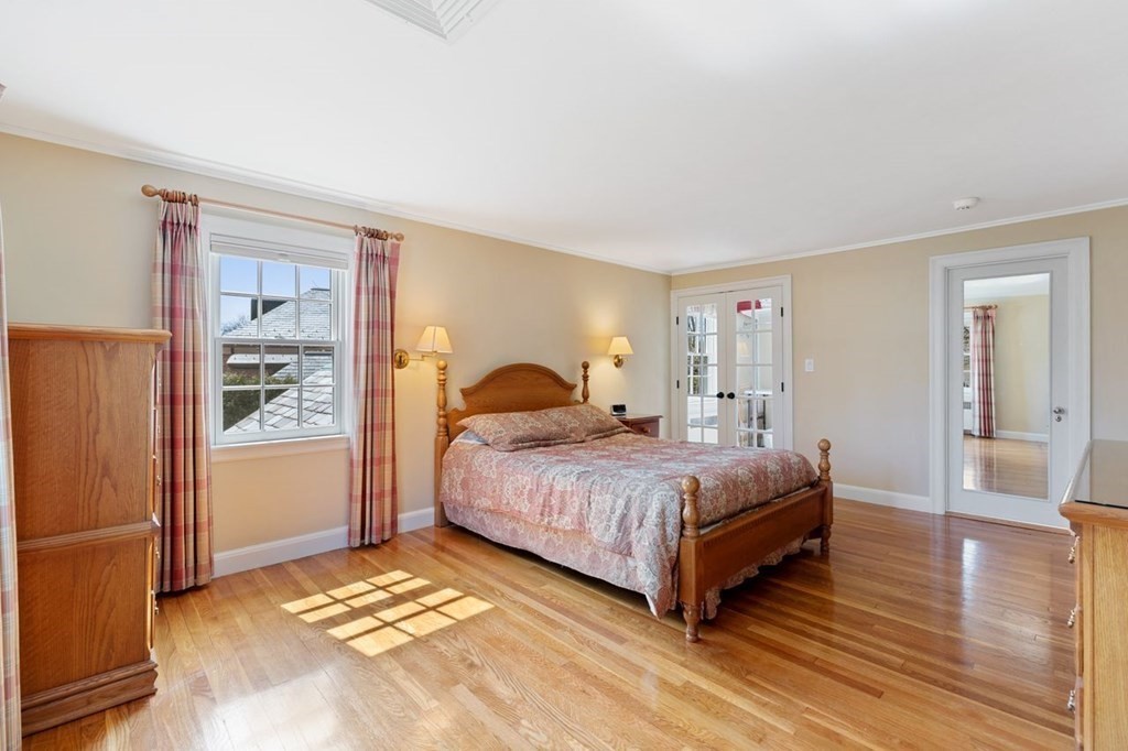 15 Gould Road Newton, MA 02468 - Photo 25 of 33 a spacious bedroom with a bed and wooden floor