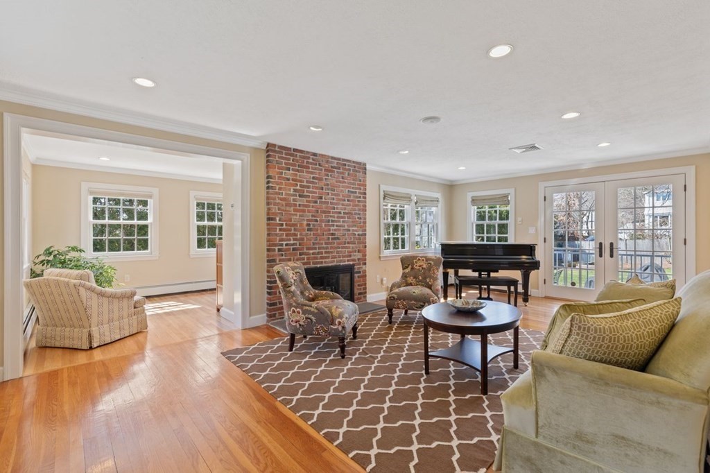 15 Gould Road Newton, MA 02468 - Photo 3 of 33 a living room with furniture and a fireplace