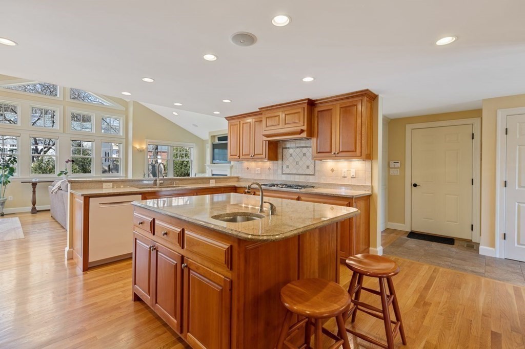 15 Gould Road Newton, MA 02468 - Photo 8 of 33 a kitchen with stainless steel appliances granite countertop a sink and a refrigerator