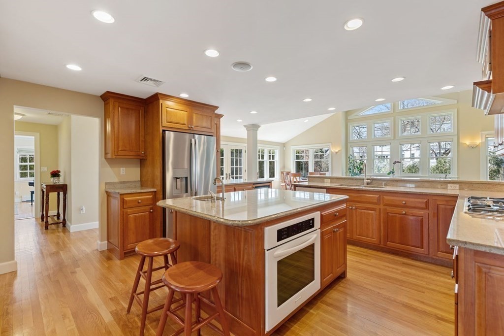 15 Gould Road Newton, MA 02468 - Photo 10 of 33 a kitchen with stainless steel appliances granite countertop a sink a stove and a refrigerator