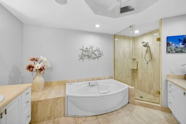 a bathroom with a shower and a sink