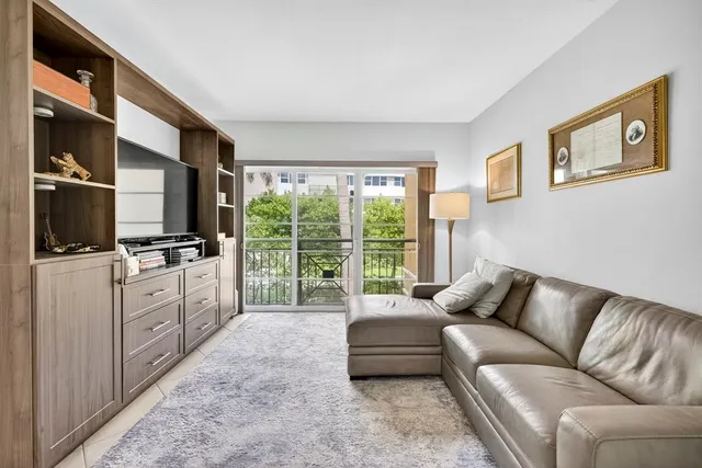 a living room with furniture and a walk in closet