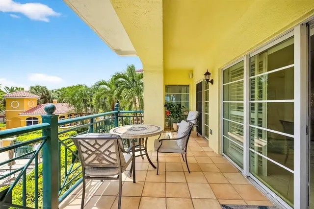 an aerial view of a house with swimming pool and garden