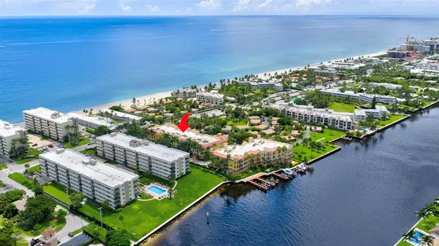 a view of a patio with table and chairs and potted plants
