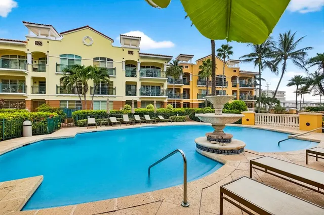 a view of swimming pool with a table and chairs