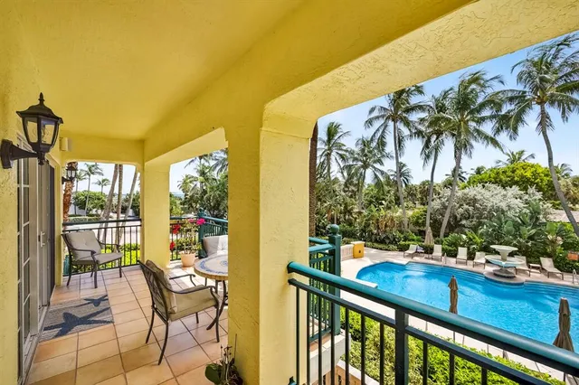 a view of a chairs and table in the patio