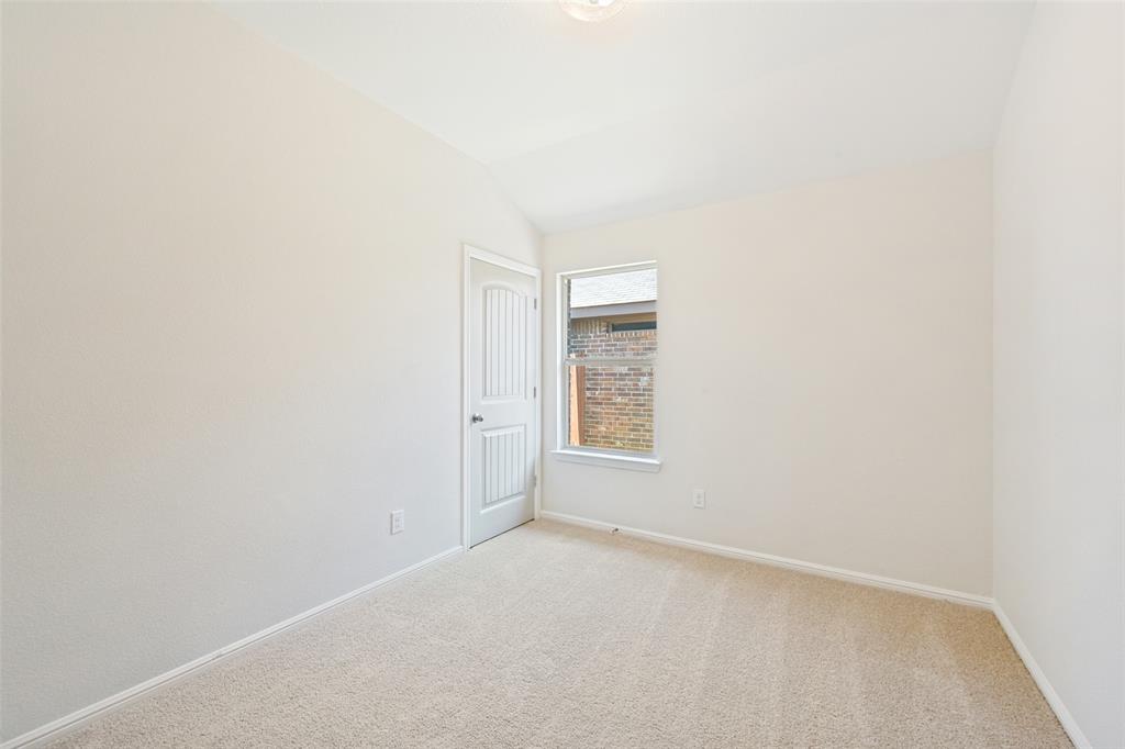 857 Watson Way Crowley, TX 76036 - Photo 17 of 25 Spacious room with vaulted ceilings and neutral carpeting