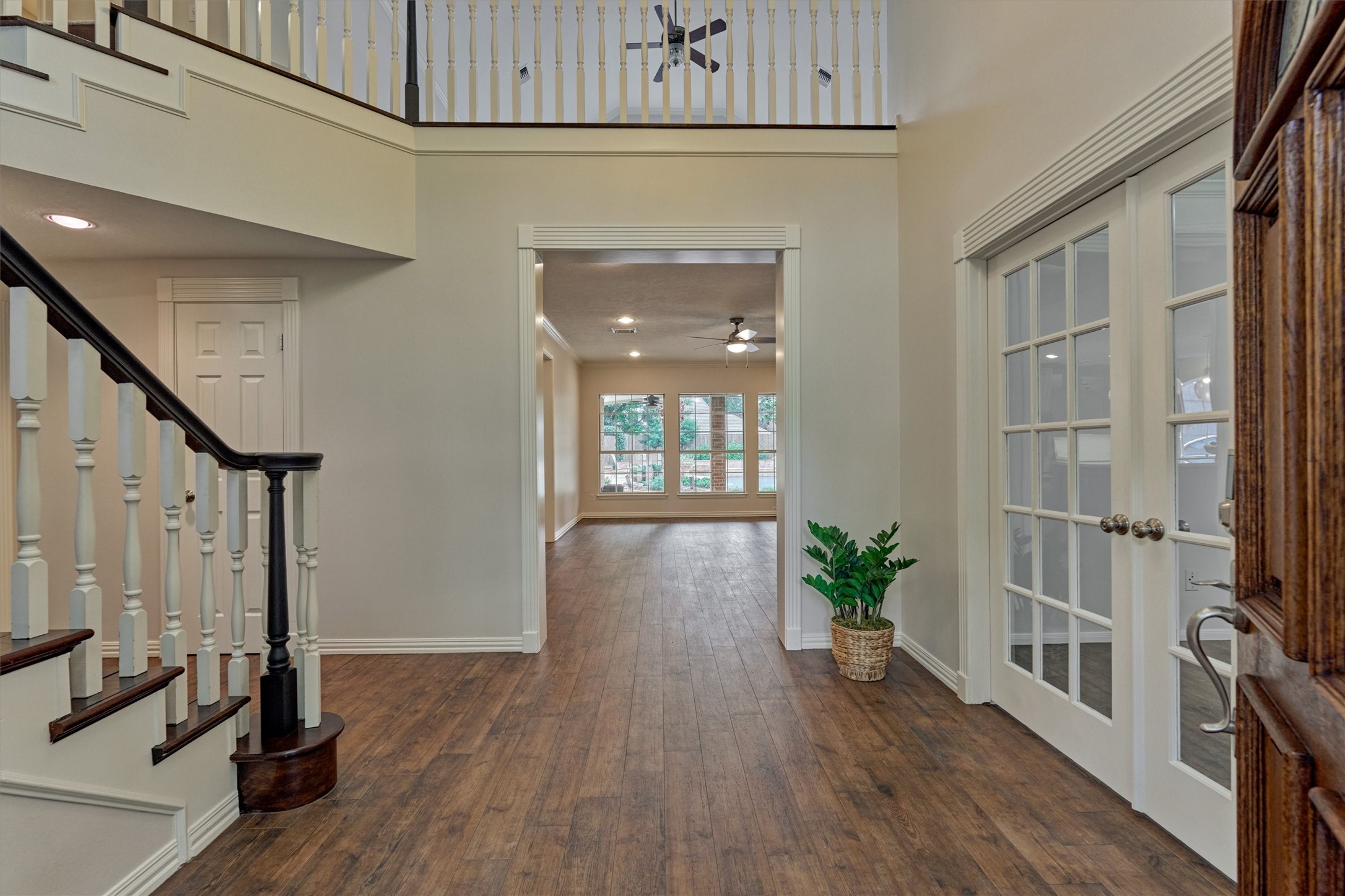 16707 Avenfield Road Tomball, TX 77377 - Photo 4 of 50 a view of an entryway with wooden floor and a front door
