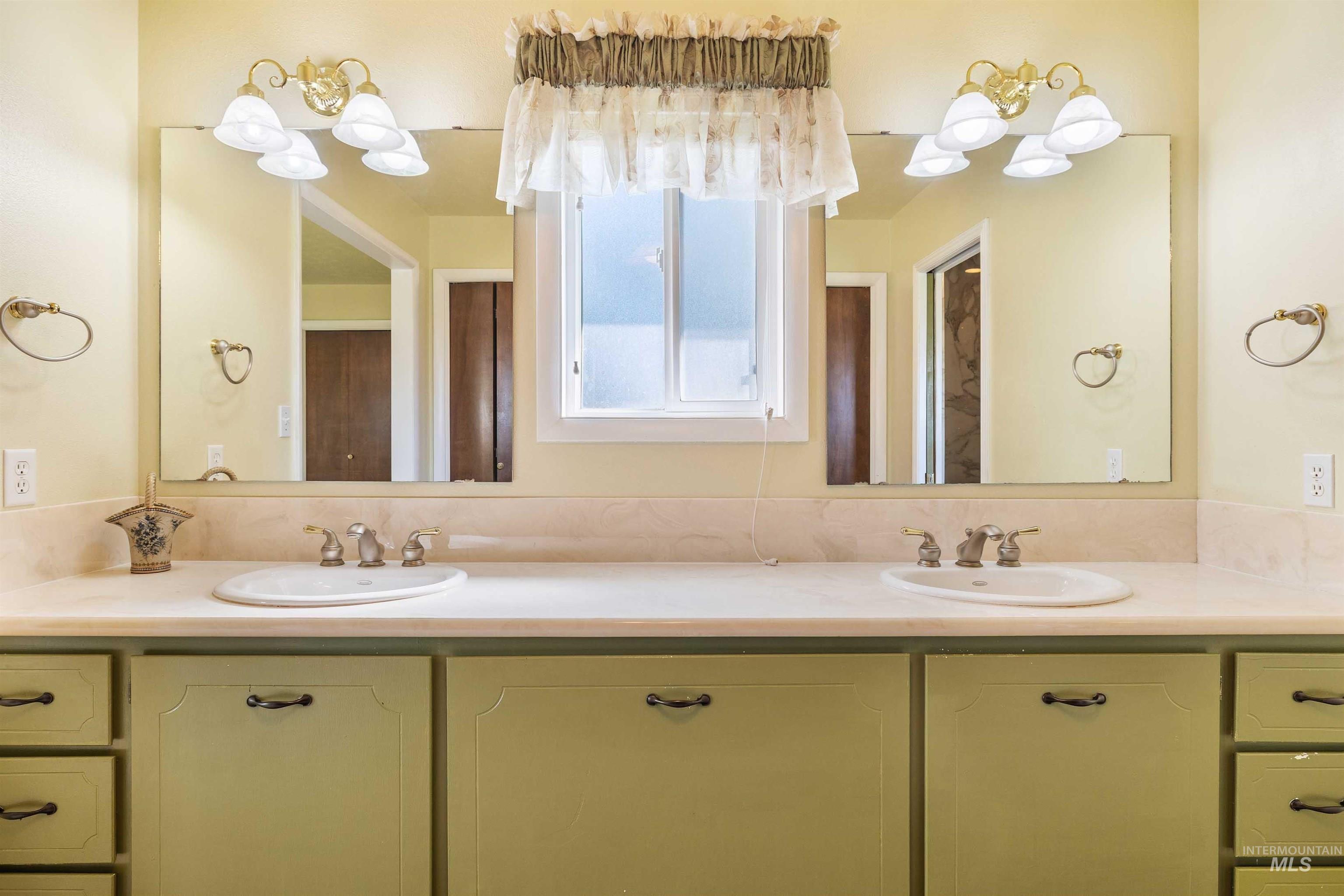 415 West 300 South Heyburn, ID 83336 - Photo 14 of 50 Bathroom featuring double vanity and a chandelier
