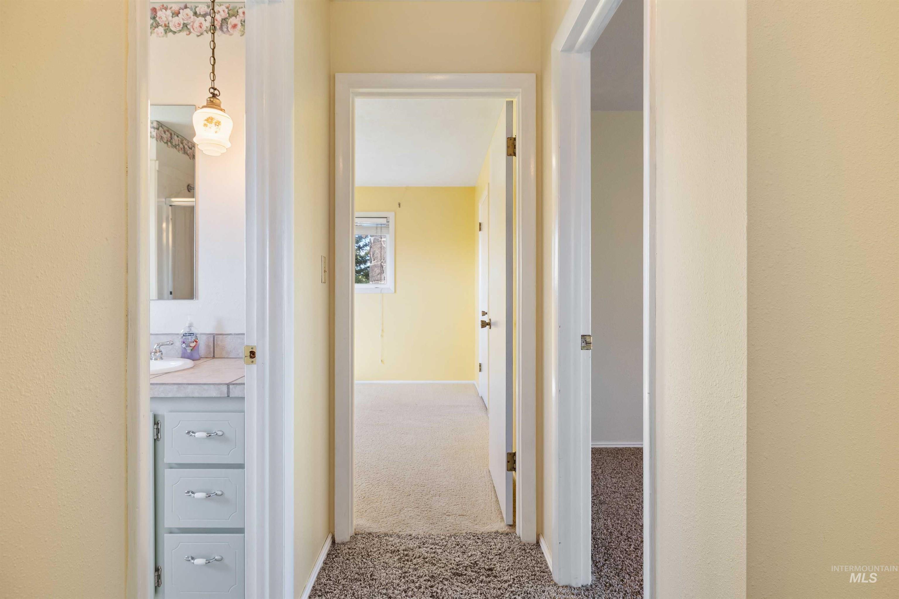 415 West 300 South Heyburn, ID 83336 - Photo 20 of 50 Corridor with carpet and baseboards