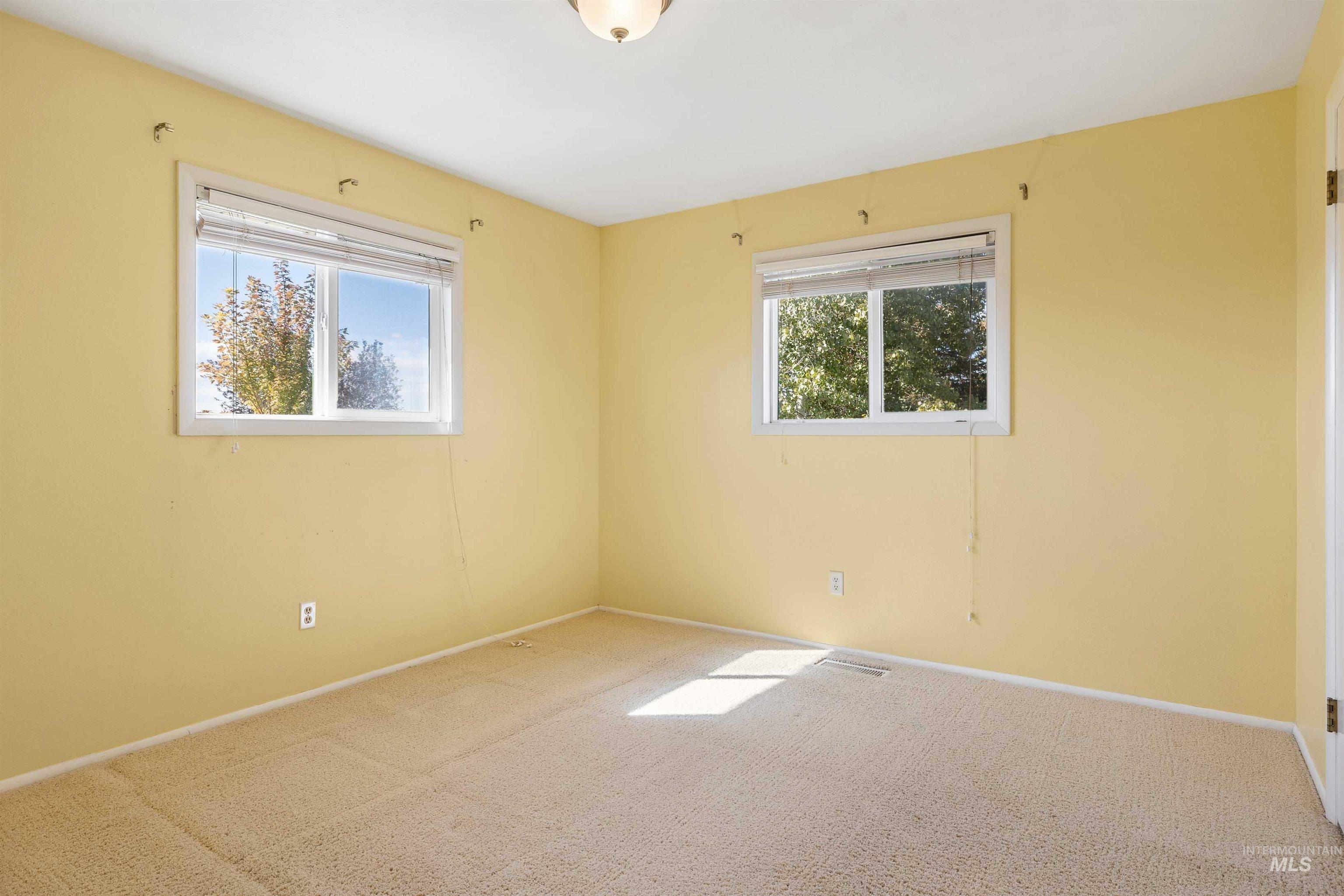 415 West 300 South Heyburn, ID 83336 - Photo 21 of 50 Unfurnished room featuring carpet floors and healthy amount of natural light