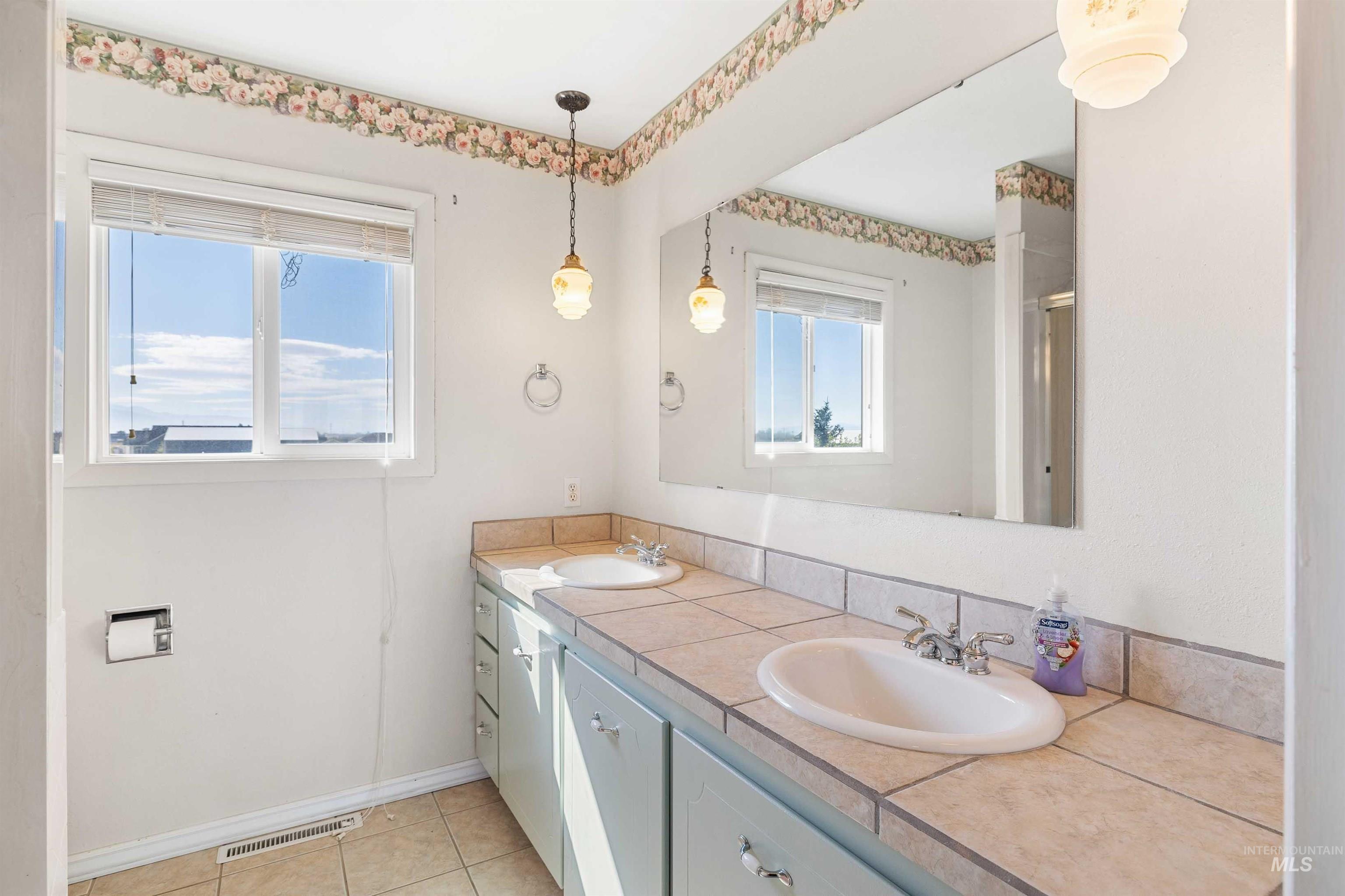 415 West 300 South Heyburn, ID 83336 - Photo 23 of 50 Bathroom featuring double vanity and light tile patterned floors