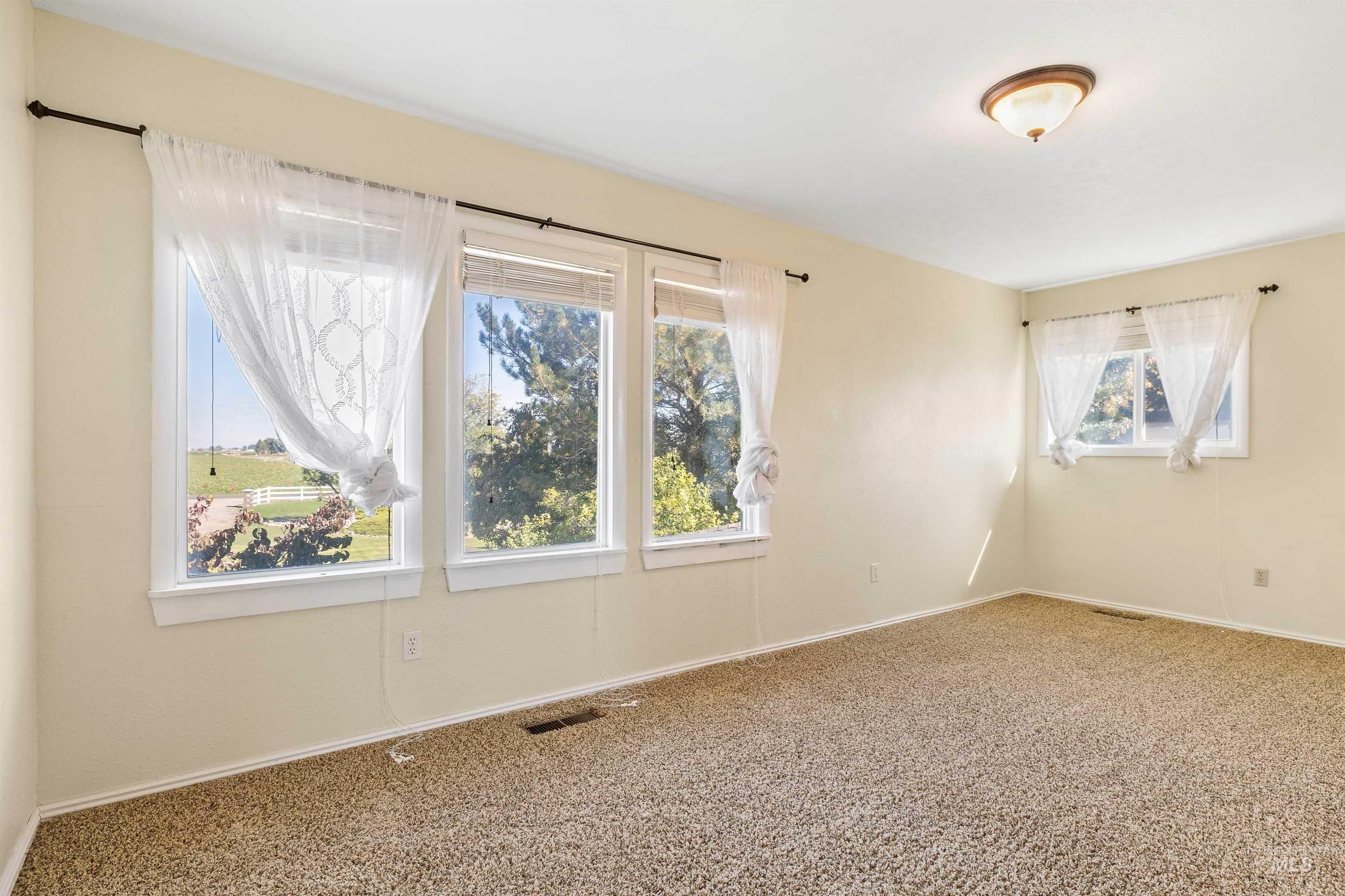 415 West 300 South Heyburn, ID 83336 - Photo 24 of 50 Empty room featuring baseboards and carpet