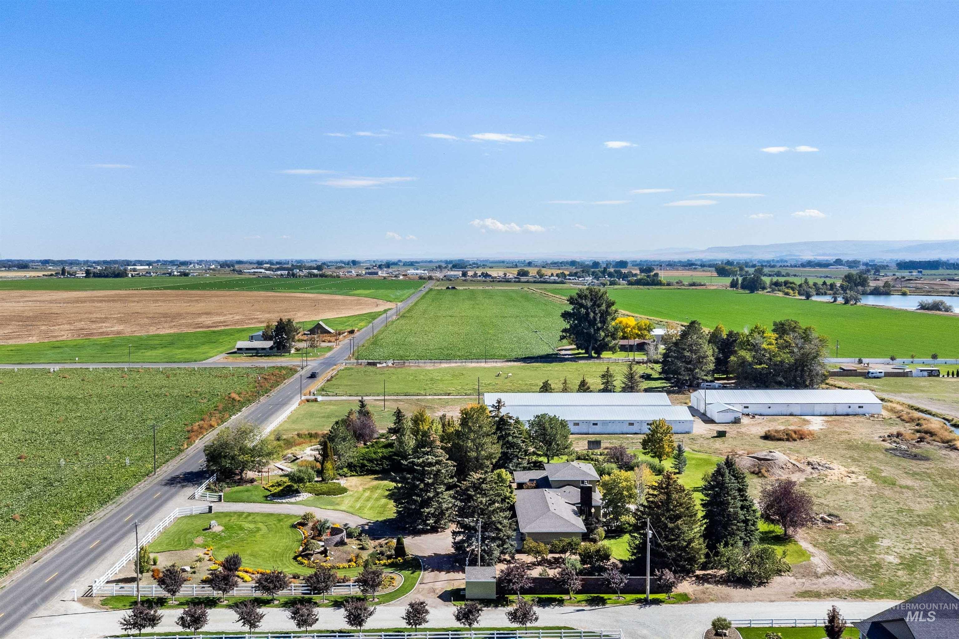 415 West 300 South Heyburn, ID 83336 - Photo 47 of 50 Aerial view of sparsely populated area with rows of crops