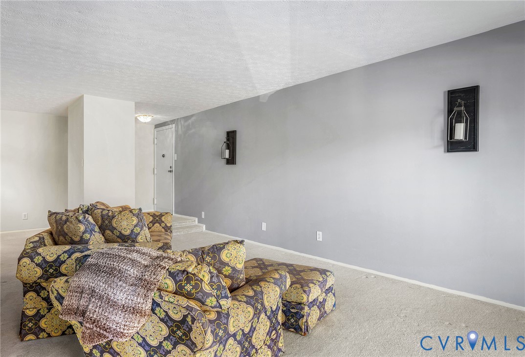 1501 Largo Road, Unit 201 Henrico, VA 23238 - Photo 14 of 31 a bedroom with a bed and white walls