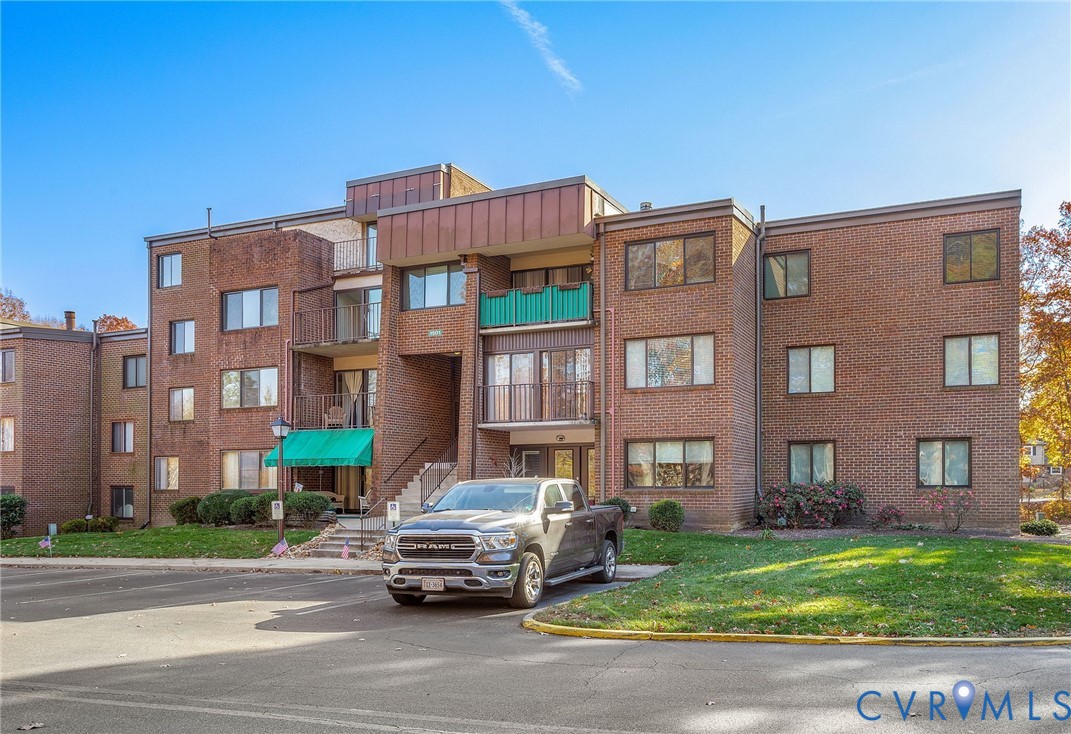 1501 Largo Road, Unit 201 Henrico, VA 23238 - Photo 20 of 31 a car parked in front of a brick building