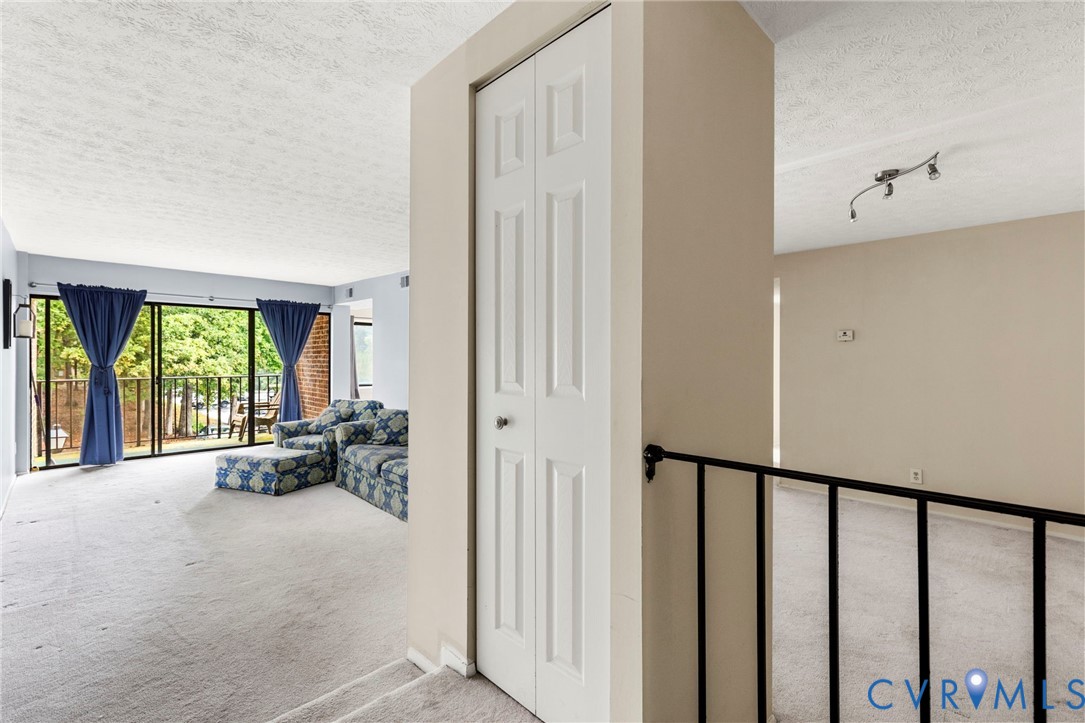 1501 Largo Road, Unit 201 Henrico, VA 23238 - Photo 24 of 31 a view of a hallway with furniture and floor to ceiling window