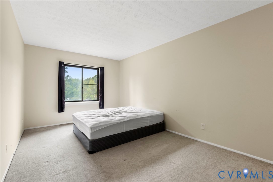 1501 Largo Road, Unit 201 Henrico, VA 23238 - Photo 25 of 31 a bedroom with a bed and a window