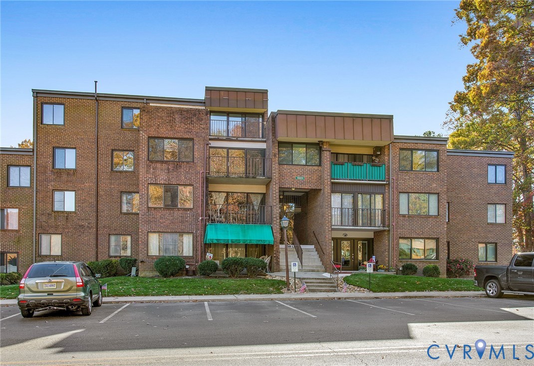 1501 Largo Road, Unit 201 Henrico, VA 23238 - Photo 3 of 31 a car parked in front of a brick building