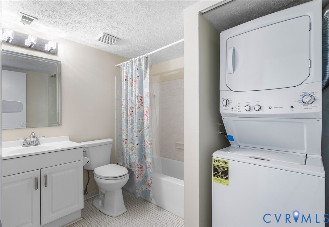 1501 Largo Road, Unit 201 Henrico, VA 23238 - Photo 9 of 31 a bathroom with a toilet sink and a mirror
