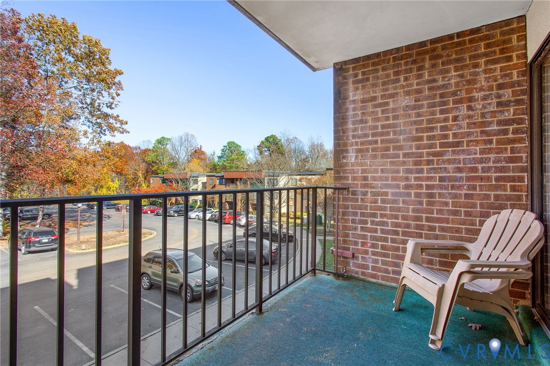 1501 Largo Road, Unit 201 Henrico, VA 23238 - Photo 10 of 31 a view of a chair and table in the balcony