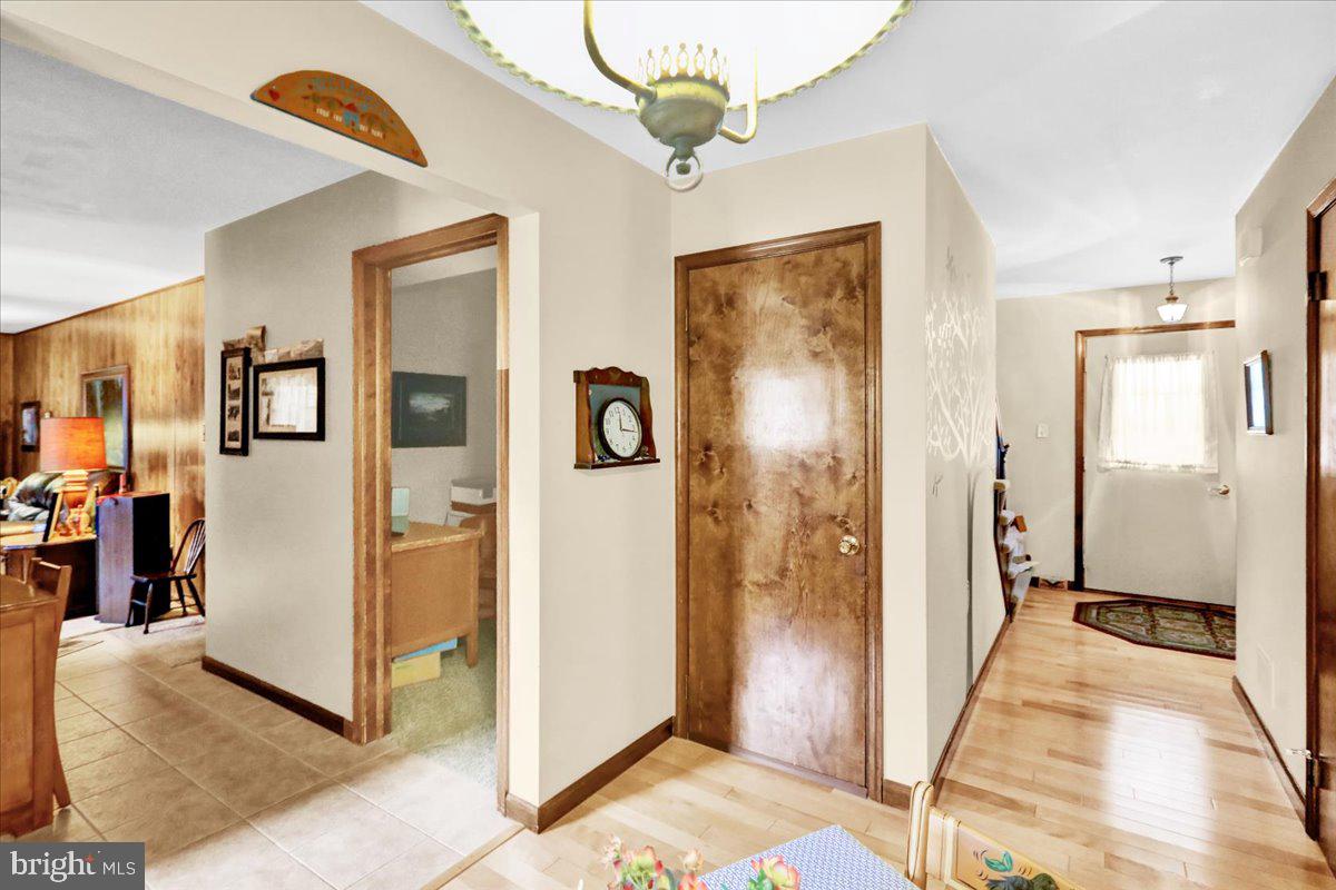 830 North Church Road Reading, PA 19608 - Photo 30 of 57 a view of a hallway with bathroom and wooden floor