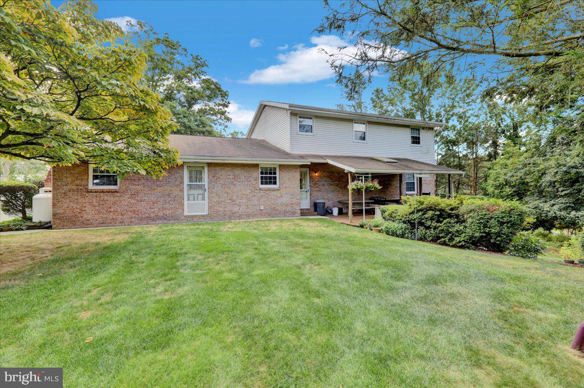 830 North Church Road Reading, PA 19608 - Photo 8 of 57 a front view of a house with a garden