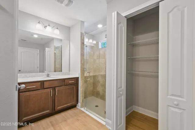 a bathroom with a shower and a sink