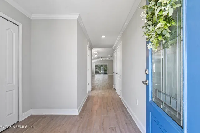 a view of a hallway view with wooden floor