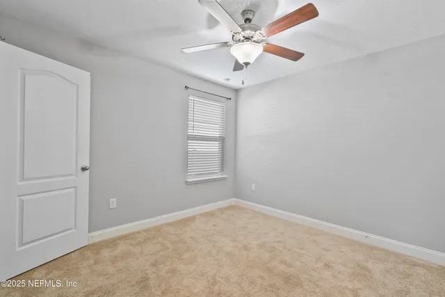 a view of a room with a large window