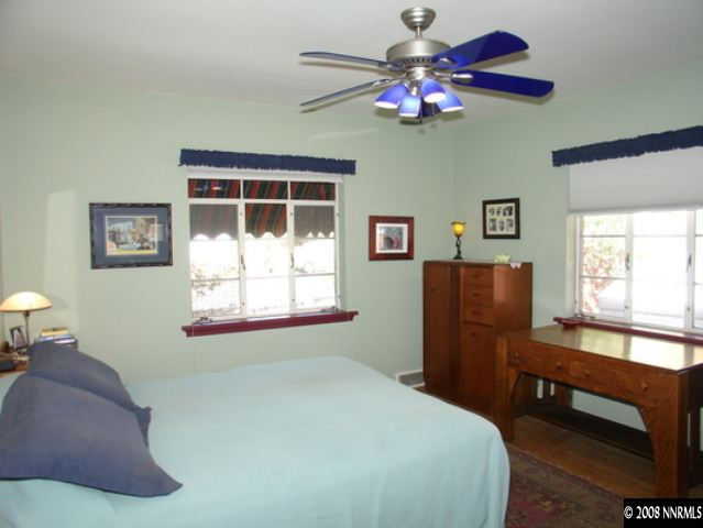 799 Gear Street Reno, NV 89503 - Photo 5 of 9 a bedroom with a bed and a chandelier