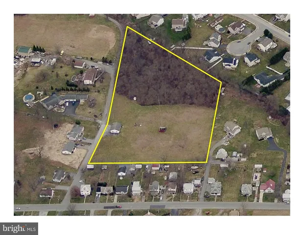 a view of road with large trees