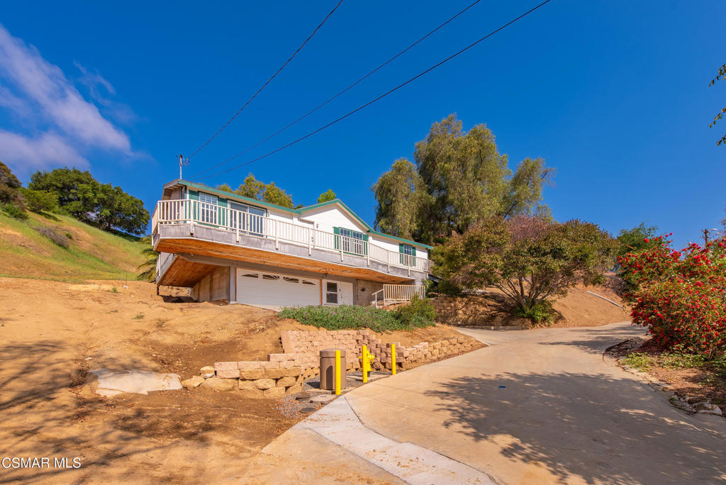 6079 Cedar Street Simi Valley, CA 93063 - Photo 1 of 31 a view of a house with a snow in the background
