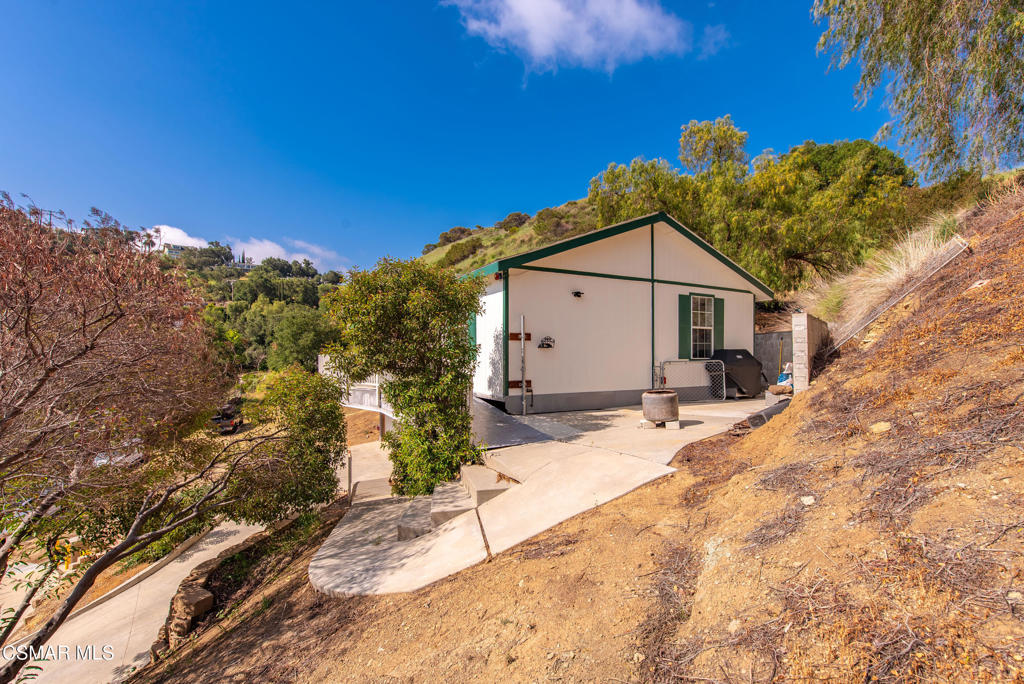 6079 Cedar Street Simi Valley, CA 93063 - Photo 26 of 31 a view of a house with a snow in the background