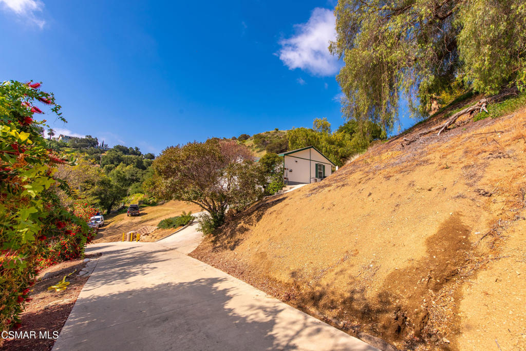6079 Cedar Street Simi Valley, CA 93063 - Photo 28 of 31 a view of a yard with wooden fence