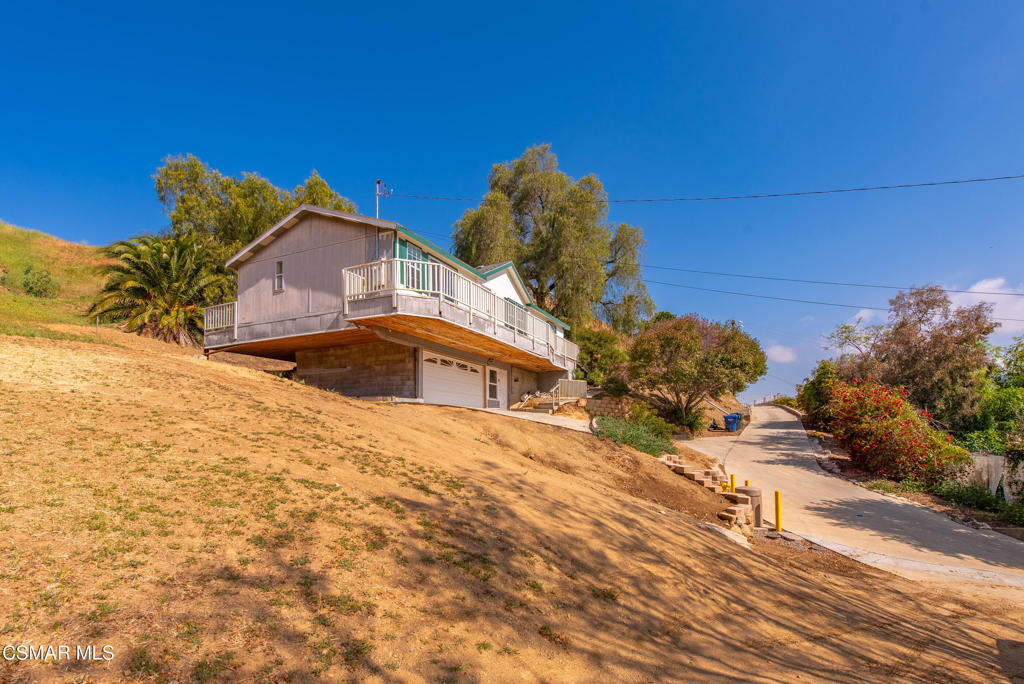 6079 Cedar Street Simi Valley, CA 93063 - Photo 29 of 31 a front view of a house with a yard