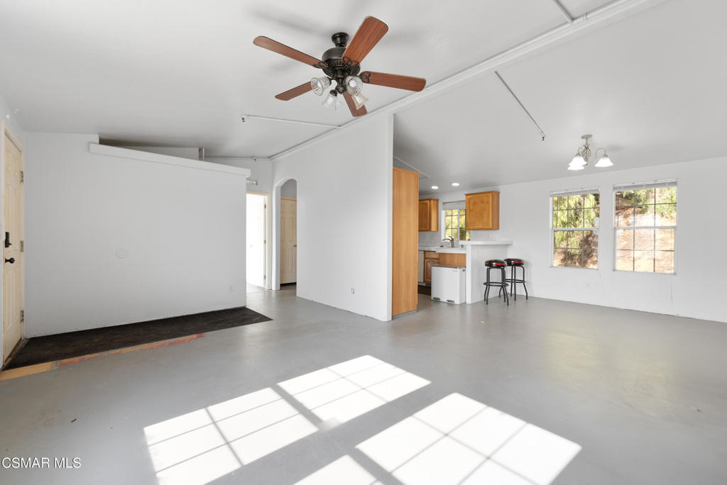 6079 Cedar Street Simi Valley, CA 93063 - Photo 3 of 31 a view of a livingroom with a lounge chair and a large window