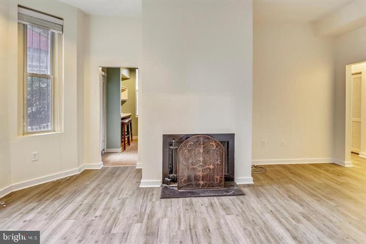 1900 3rd Street Northwest, Unit 1 Washington, DC 20001 - Photo 15 of 20 a view of an empty room with wooden floor and a window