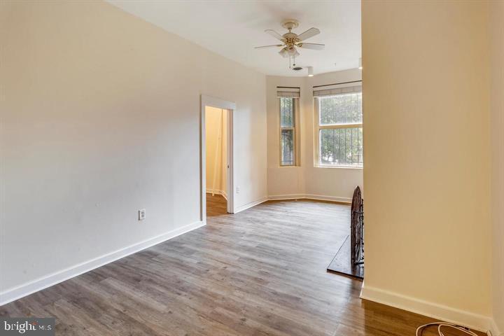 1900 3rd Street Northwest, Unit 1 Washington, DC 20001 - Photo 18 of 20 an empty room with windows and wooden floor