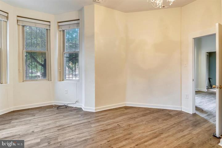 1900 3rd Street Northwest, Unit 1 Washington, DC 20001 - Photo 8 of 20 an empty room with wooden floor and windows