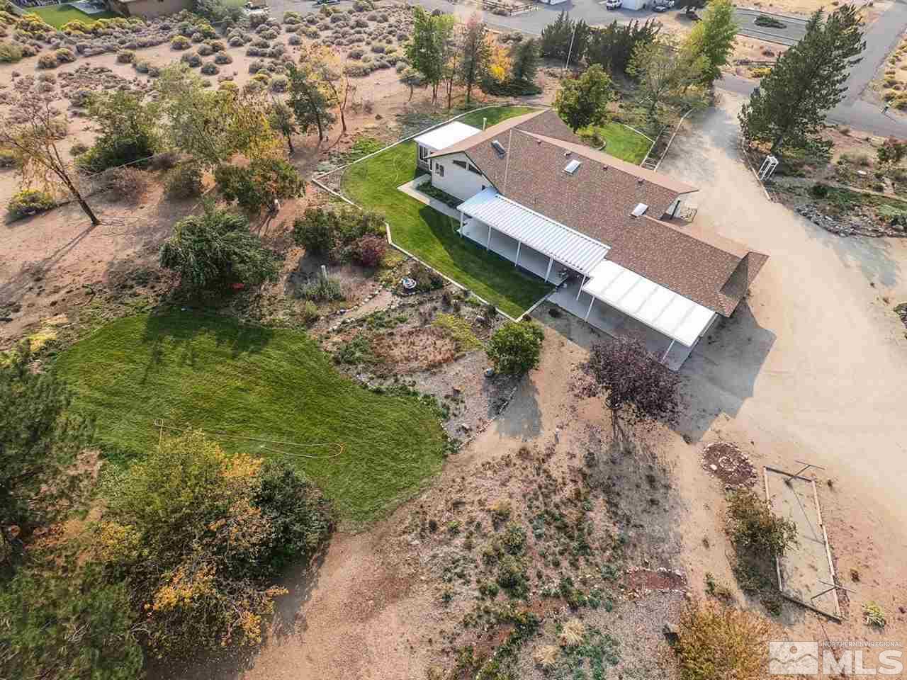 817 Rubio Way Gardnerville, NV 89460 - Photo 1 of 28 an aerial view of a house with a yard