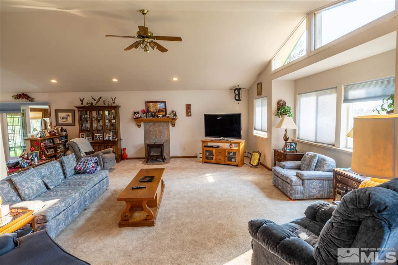 817 Rubio Way Gardnerville, NV 89460 - Photo 11 of 28 a living room with furniture and a flat screen tv