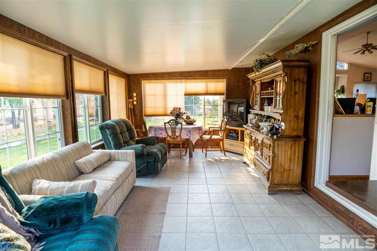817 Rubio Way Gardnerville, NV 89460 - Photo 15 of 28 a living room with fireplace furniture and a large window