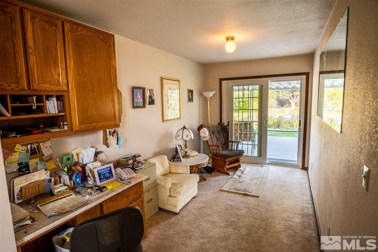 817 Rubio Way Gardnerville, NV 89460 - Photo 16 of 28 a room with furniture a flat screen tv and a window
