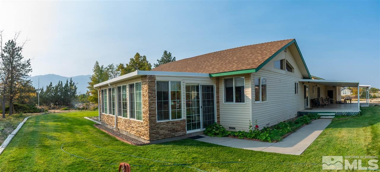 817 Rubio Way Gardnerville, NV 89460 - Photo 2 of 28 a view of a house with a yard and potted plants