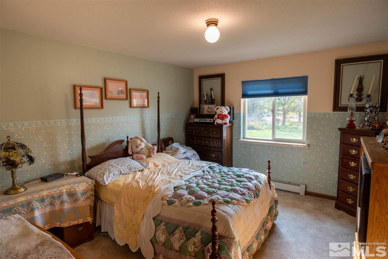 817 Rubio Way Gardnerville, NV 89460 - Photo 21 of 28 a bedroom with a bed and a window