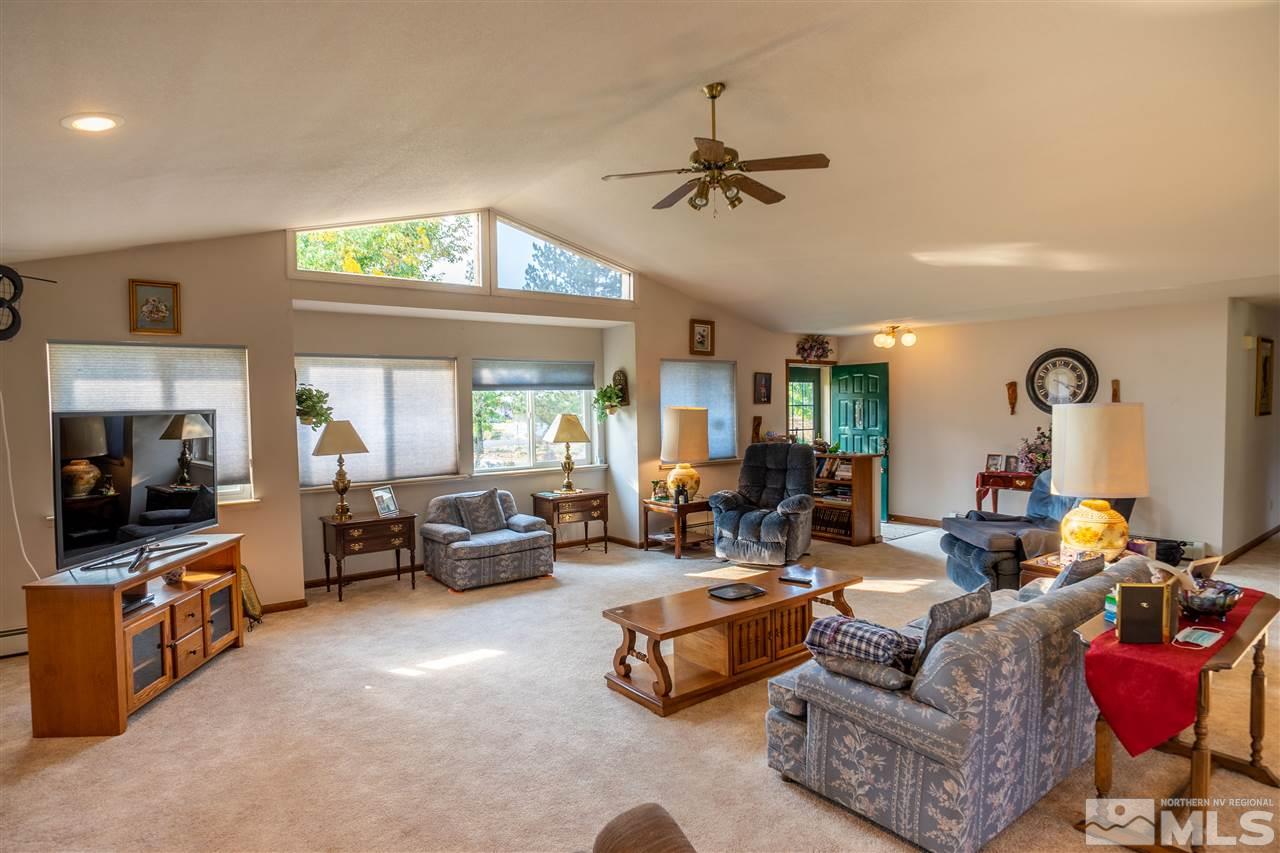 817 Rubio Way Gardnerville, NV 89460 - Photo 10 of 28 a living room with furniture and a large window