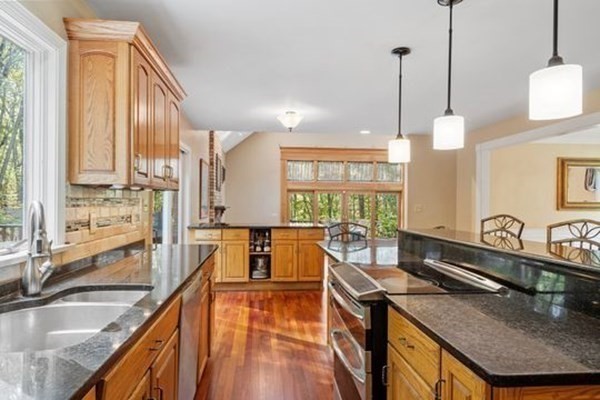 77 Teele Road Bolton, MA 01740 - Photo 12 of 41 a kitchen with large windows sink and cabinets
