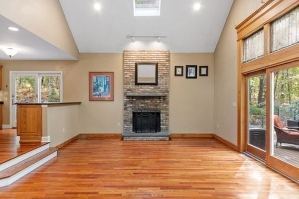 77 Teele Road Bolton, MA 01740 - Photo 13 of 41 a view of an empty room with window and wooden floor