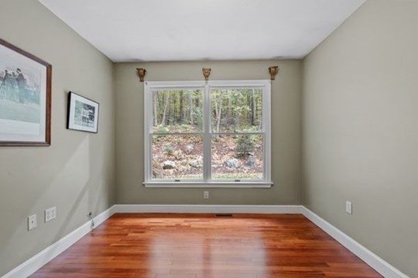 77 Teele Road Bolton, MA 01740 - Photo 16 of 41 a view of an empty room with wooden floor and a window